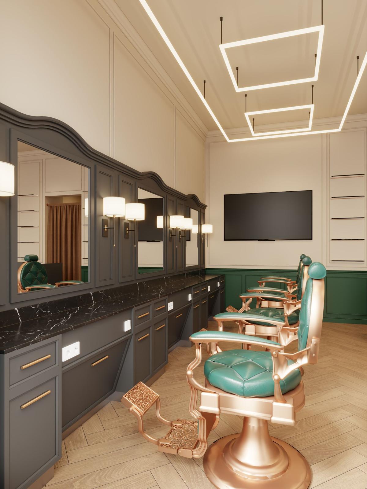 Modern barbershop interior with green cushioned gold barber chairs, black marble countertop, large mirrors, and geometric ceiling lights.